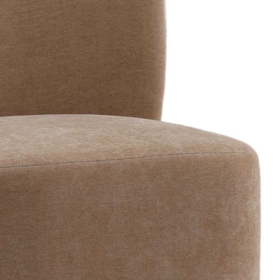 Dining chair by Dovetail Saoirse in warm beige woven textile upholstery featuring an integrated cushion and rounded backrest