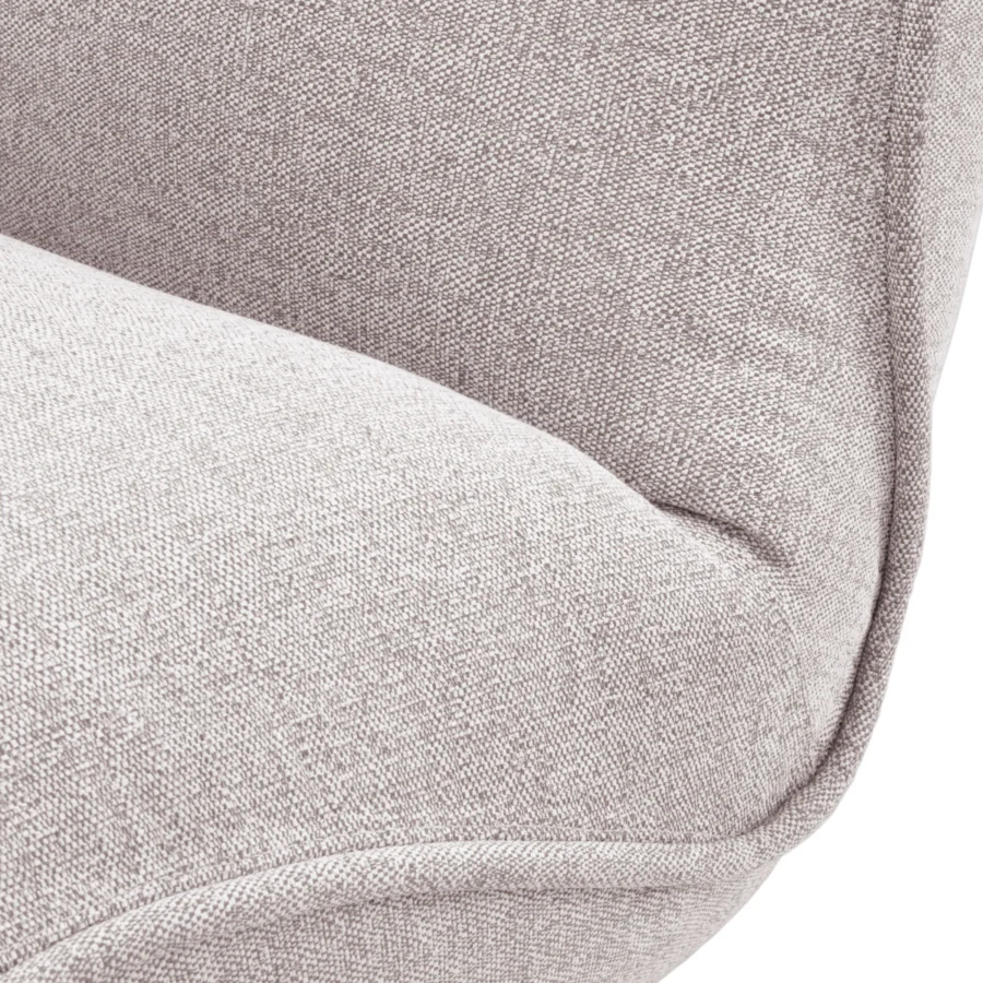 Lounge chair by Eichholtz in light gray Mauritius fabric with heathered taupe tones, piped edges and black metal base