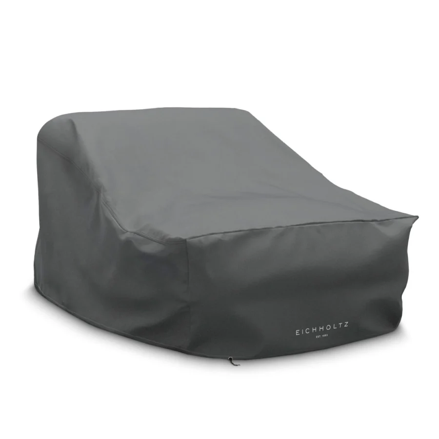 Lounge chair by Eichholtz in light gray Mauritius fabric with black powder coated stainless steel base and synthetic cover