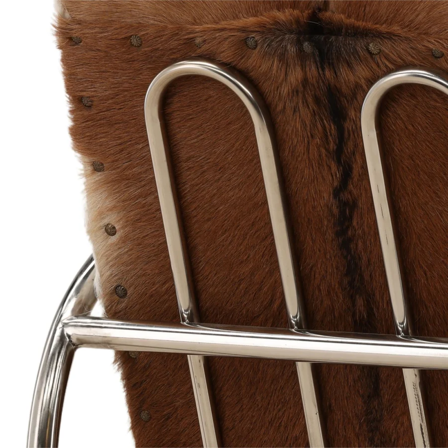 Lounge chair by Dovetail in natural brown white hair-on-hide upholstery with nailheads and polished metal tubular frame