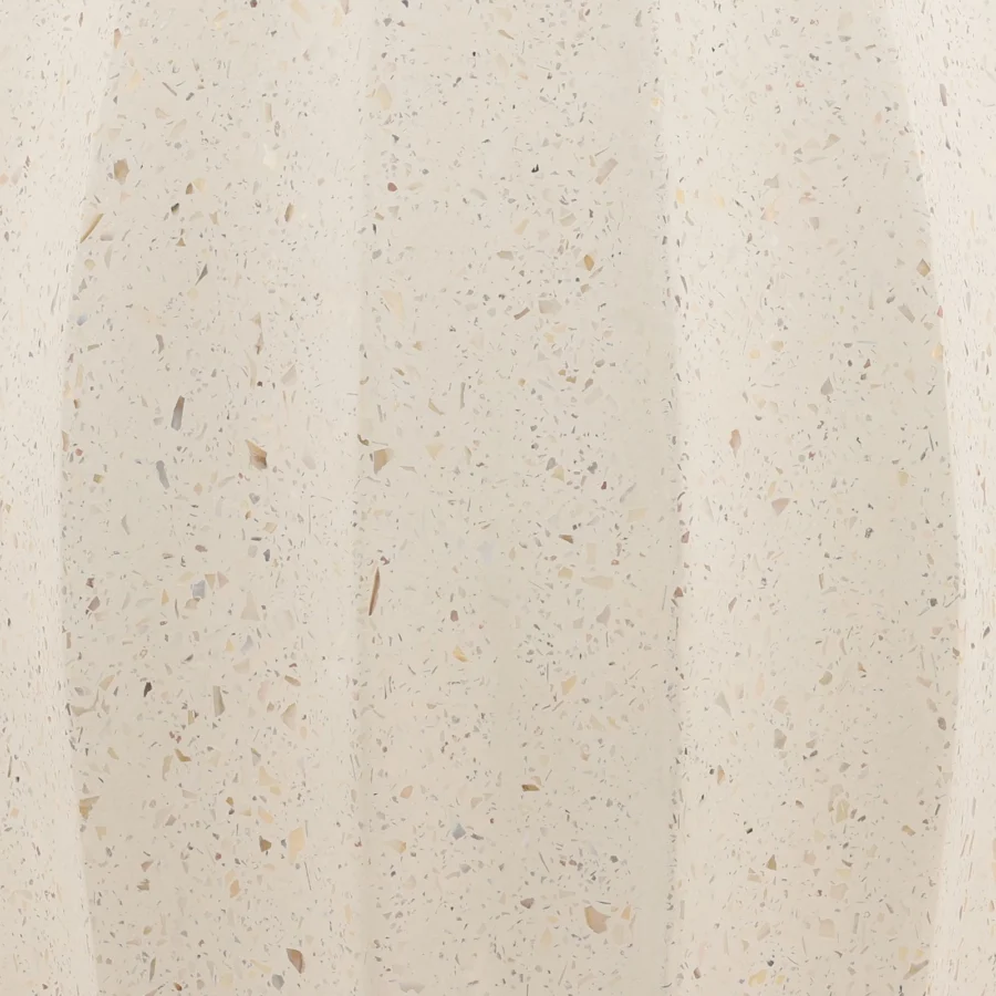 Vase by Dovetail in composite material with matte finish, showing faceted silhouette, off-white, cream, speckled tones