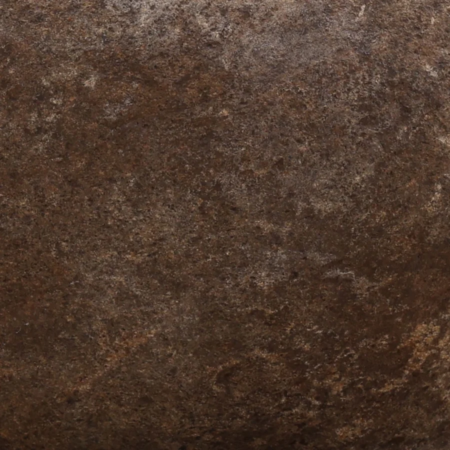 Bowl by Dovetail crafted from stone featuring matte textured finish in deep brown charcoal rust tones