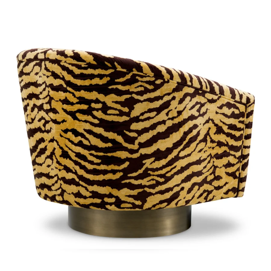 Lounge chair by Eichholtz in Tigris brown tiger-print textile upholstery with a curved silhouette and brushed brass base