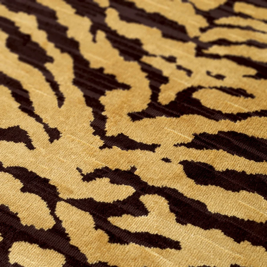 Swivel lounge chair by Eichholtz in Tigris brown tiger print upholstery with brushed brass base and gold stripes