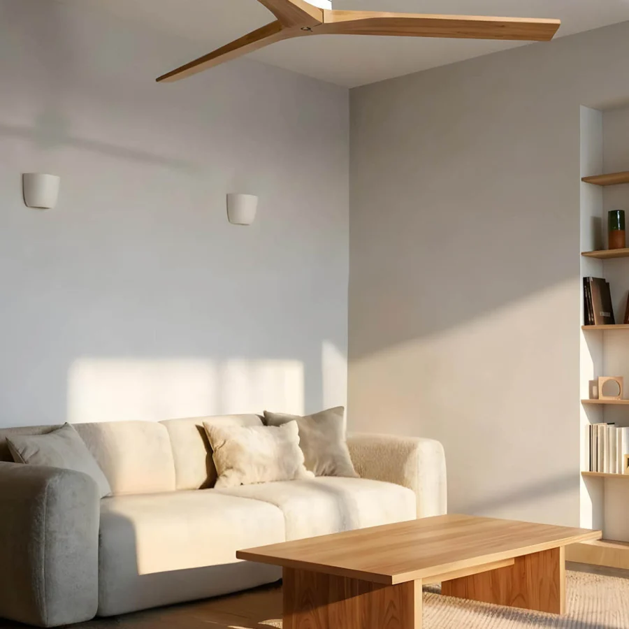 Ceiling fan by Faro Barcelona with matte white metal motor housing and natural grain wood blades in a minimalist silhouette