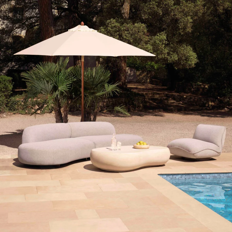 Sofa by Eichholtz Bjorn in light gray Mauritius fabric upholstery with black powder coated stainless steel legs