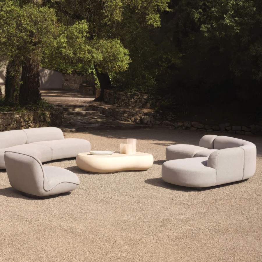 Sofa by Eichholtz Björn in light gray Mauritius fabric with black powder coated stainless steel legs and organic forms